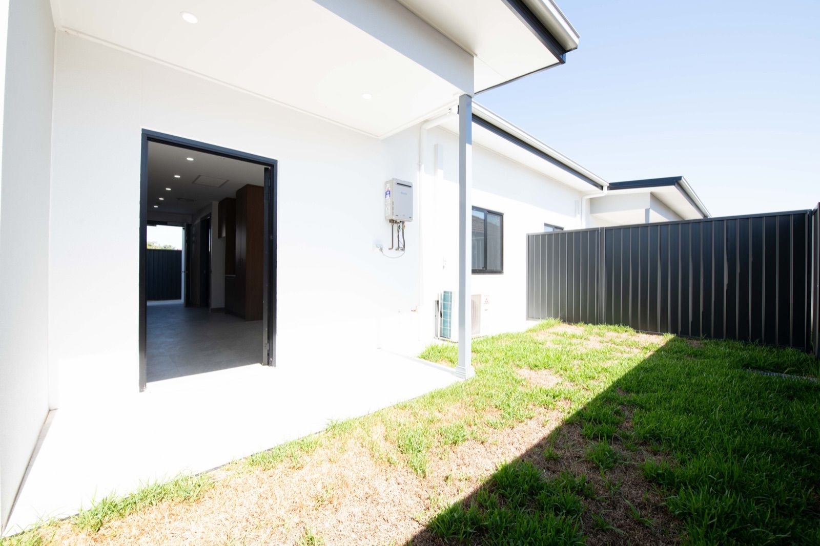 Photo 7 of 11: Covered outdoor area opening onto a private grassed yard