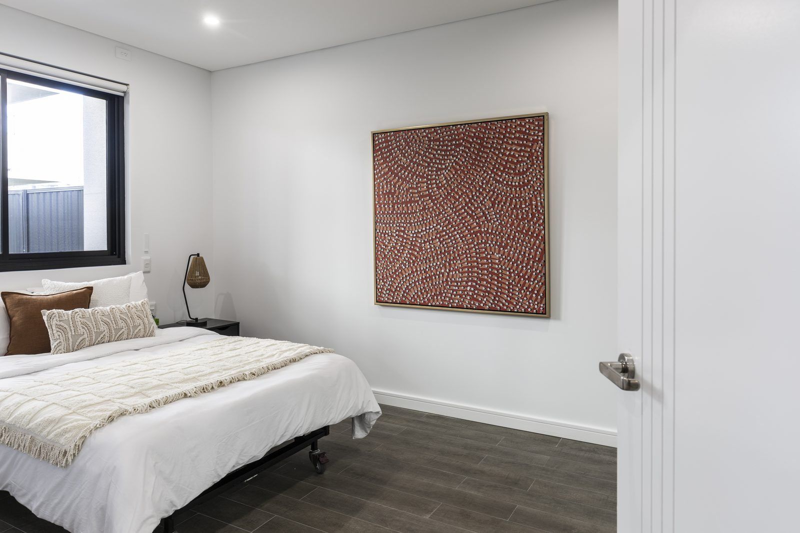 Photo 3 of 8: Bedroom with a large window and artwork above the bed