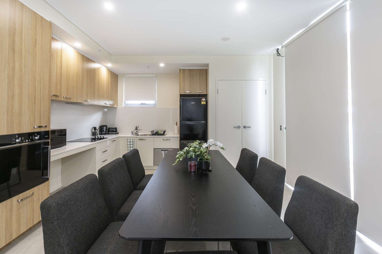 Photo 9 of 11: Communal kitchen and dining room with a long table