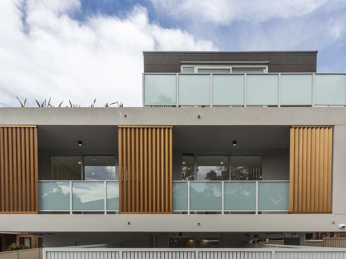 Front of the Todd Street apartment building in Merrylands, with timber screens and glass balconies