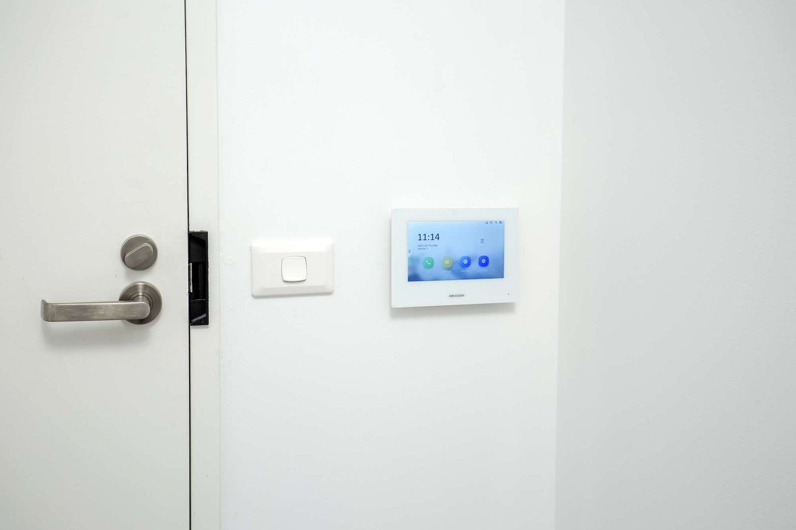 Photo 8 of 10: Door handle with a touch-screen intercom panel beside it
