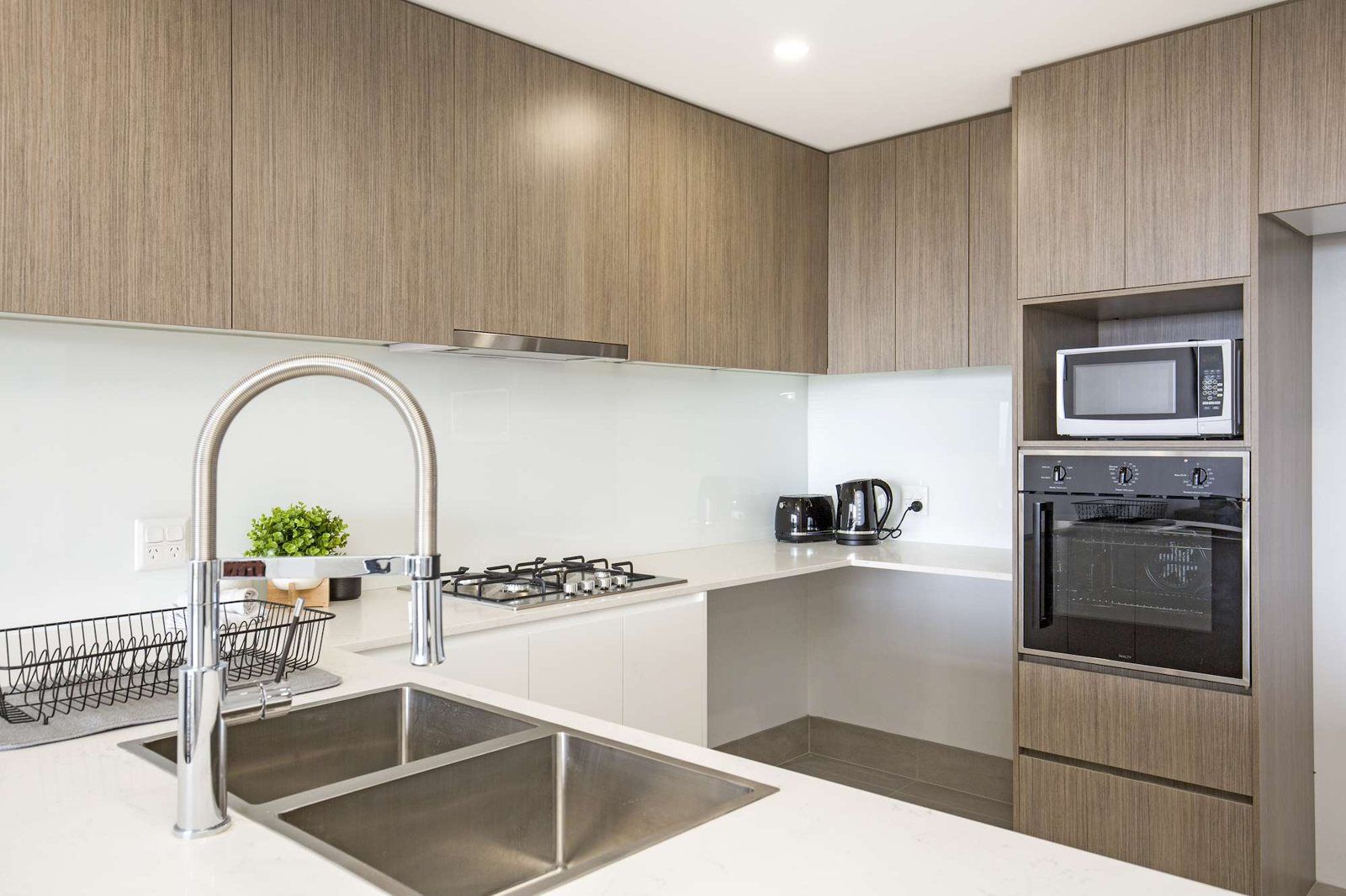 Photo 3 of 10: Kitchen with a gas cooktop, wall oven and timber cabinets
