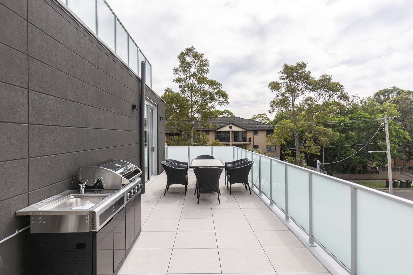 Photo 8 of 11: Rooftop terrace with a BBQ, outdoor dining table and treetop views