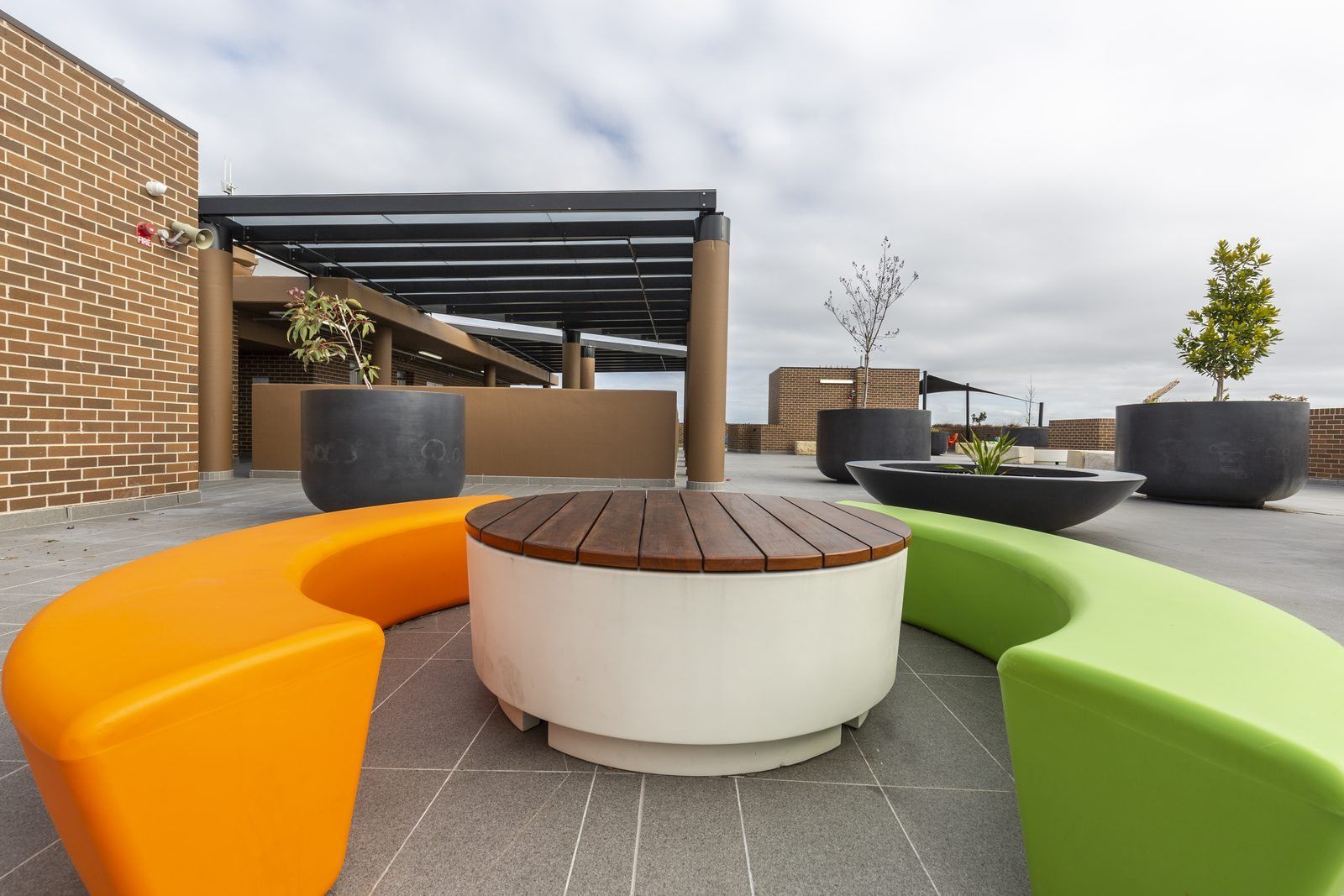 Photo 8 of 8: Rooftop terrace with a pergola, planters and curved seating